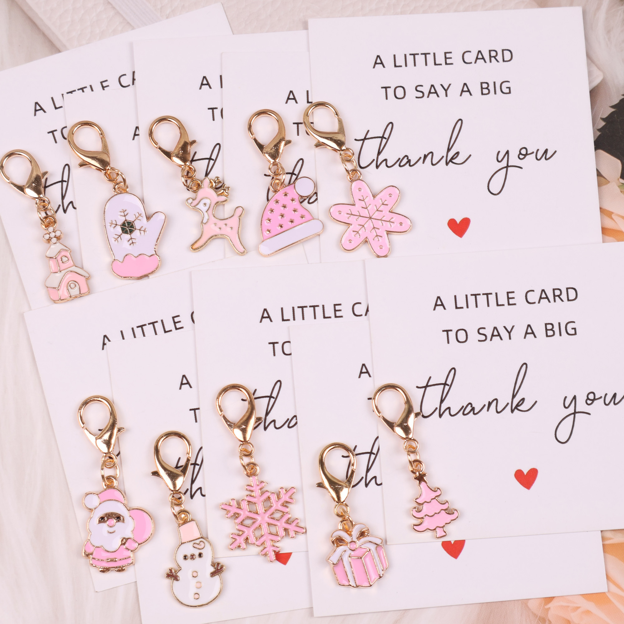 TEMU Cadeau pour elle/lui 10 sacs cadeaux de Noël roses uniques, ensemble de porte-clés pour fête de Noël : comprend un de neige, Père Noël, un , un