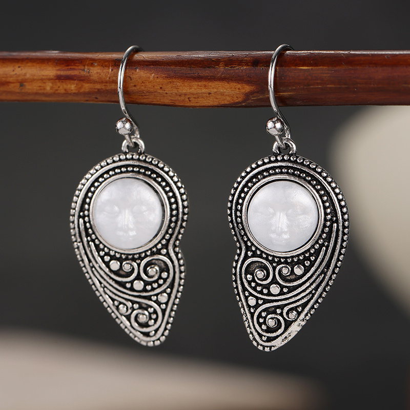 Vintage-style Silvery Teardrop Earrings with Embossed Design