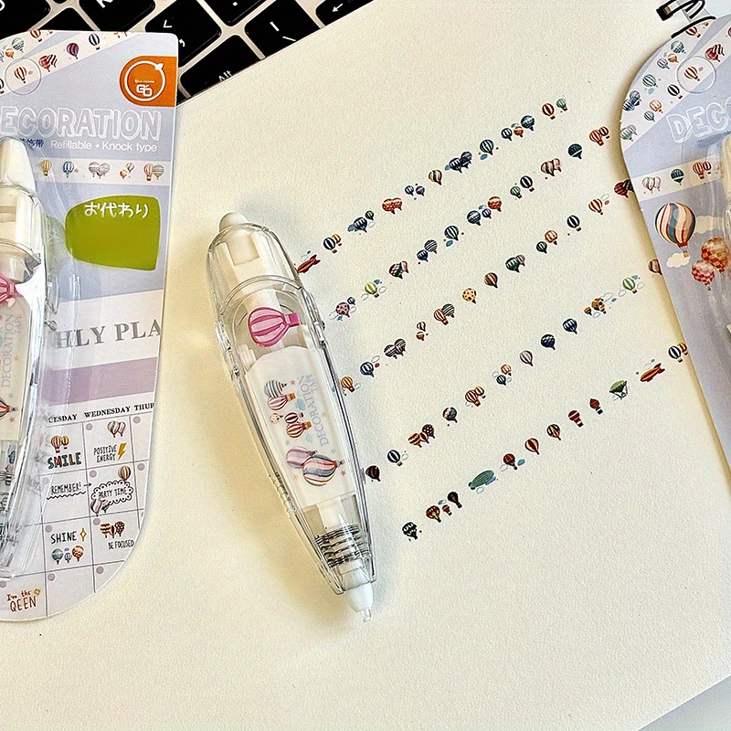 Image of A Pen For Embossing With A Design Of Multi-colored Hot Air Balloons, Perfect For Projects, Scrapbooking, And Journaling. The Shapes Of The Hot Air Balloons Enhance The Of Your Handmade