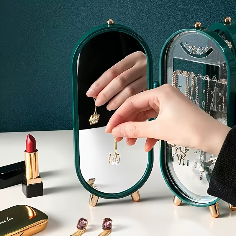 a foldable jewelry storage box with a   featuring a large capacity earring and necklace holder with   designed as an attractive display case for dressing tables it   a foldable earring clip jewelry organizer Product details 3