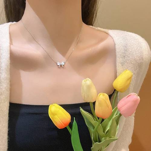 a stylish and elegant light luxury opal bow knot necklace for women a versatile and fashionable stainless steel floral sparkling bow knot pendant necklace a delicate and piece of jewelry for women to or at parties