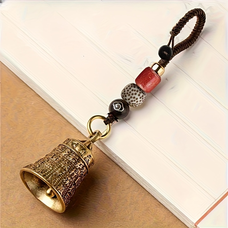 Handcrafted Vintage Tibetan Bell Keychain With Braided Cord And Beads - Intricate Carved Design, Red And Black Beads, For Good Luck, Travel, Camping, And Holiday Gifts