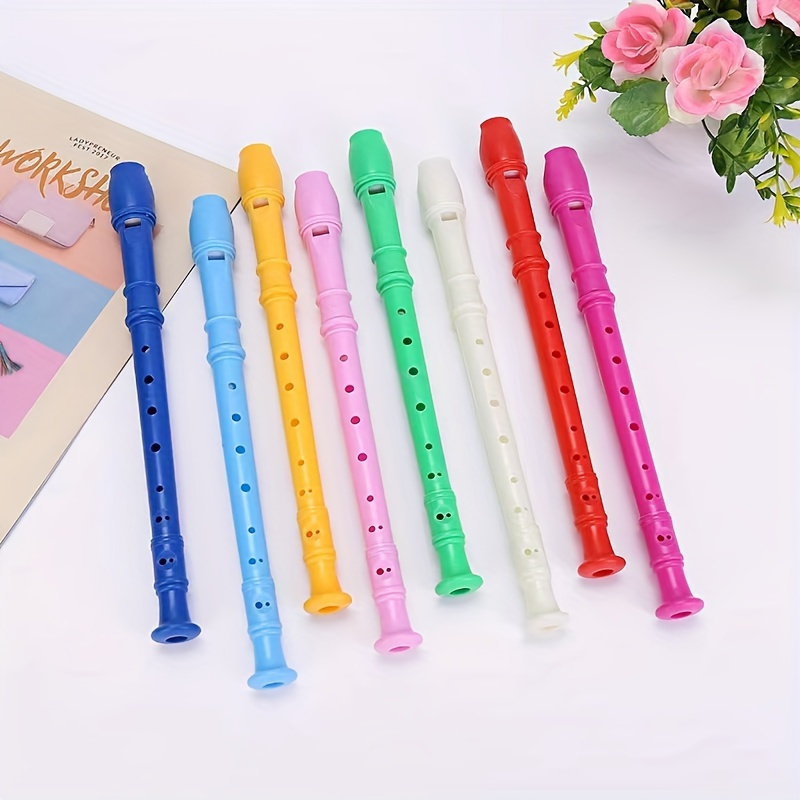 

Une aiguë, instrument musical en plastique, surface polie, à six trous, disponible en blanc, rouge, rose, jaune, vert et bleu.