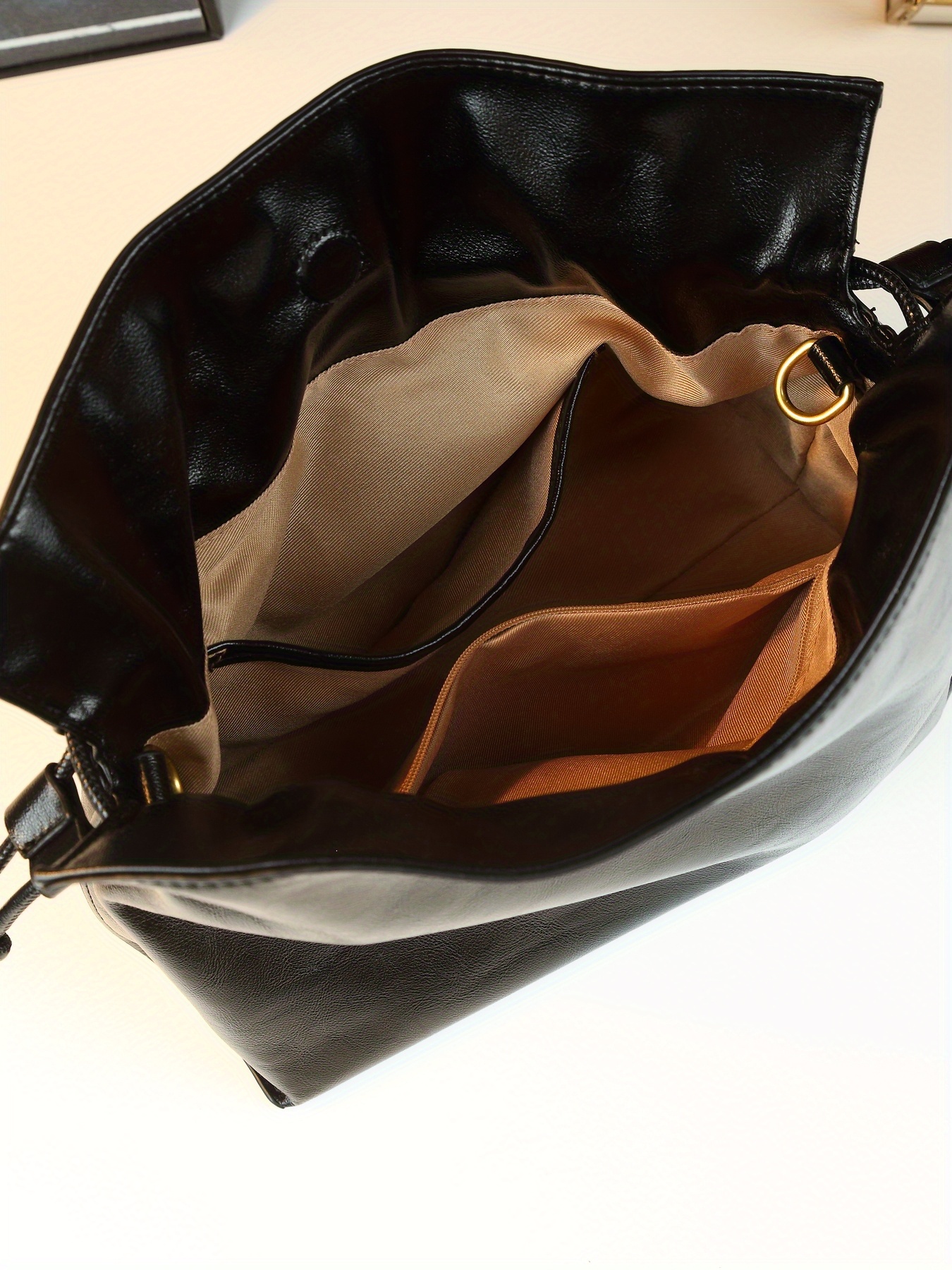 Black Drawstring Handbag worn on arm