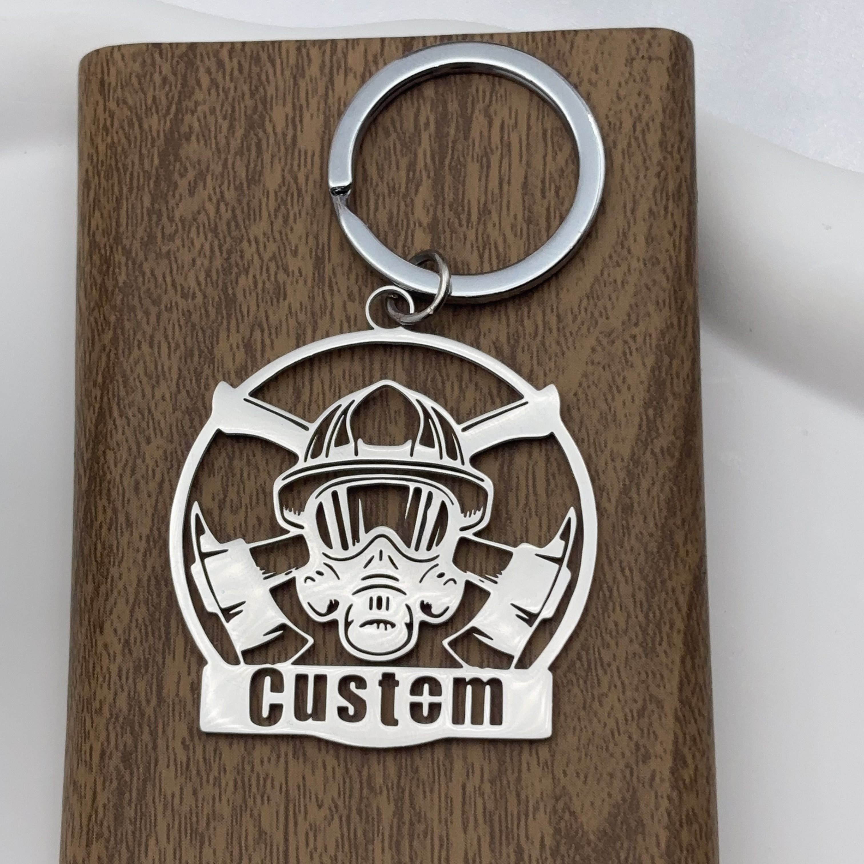 TEMU A Personalized Laser-cut Stainless Steel Keychain, Featuring A Stylish Firefighter And Axe Design, Decorating Bags, Keys, Belts, And Backpacks.