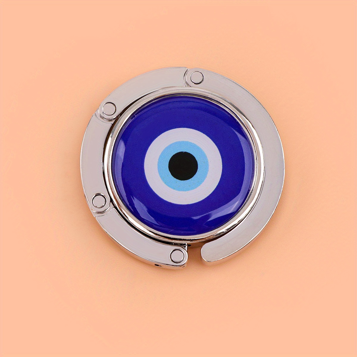 Image of A Single Eye Purse Hanger A Casual, Foldable Handbag Hook Suitable For Travel, Perfect For Storing Bags On Tables, And Makes A Unique Gift Option