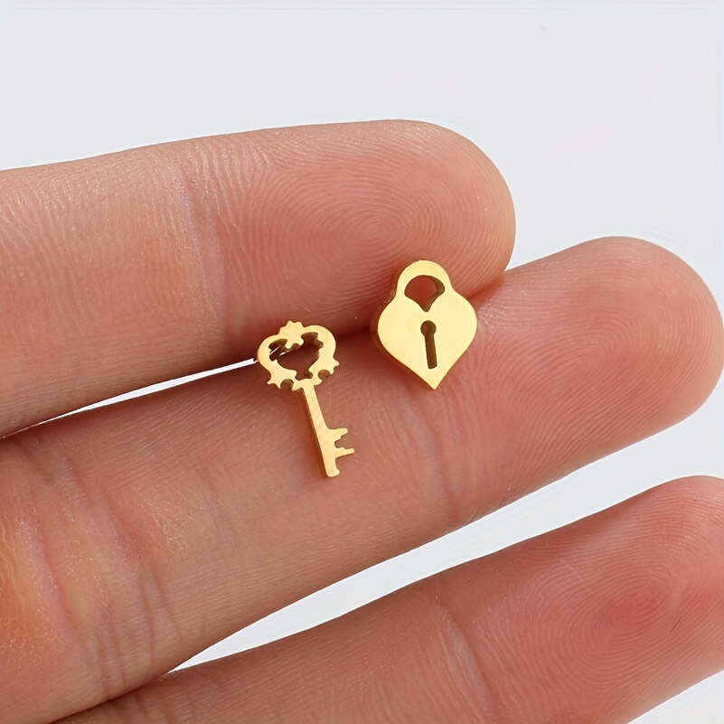 Asymmetrical heart padlock and heart card post earrings