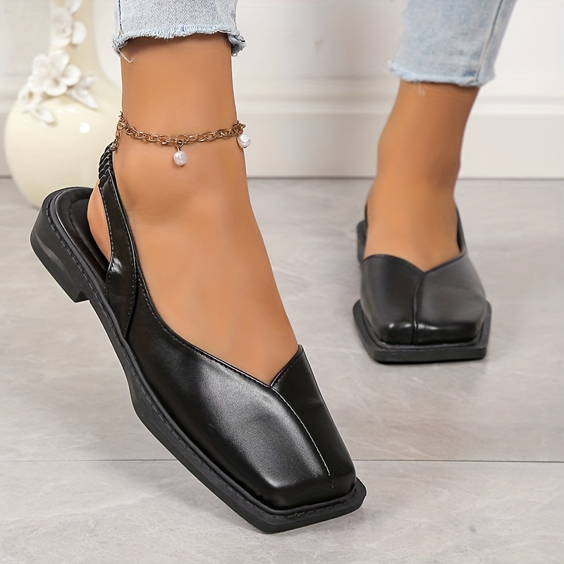 Zapatos planos destalonados de dos tonos con diseño de lazo de punta