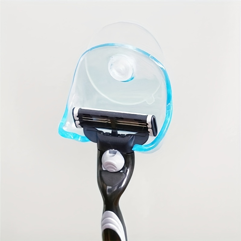 Use a razor holder with suction-cup to hold your dish scrubber so