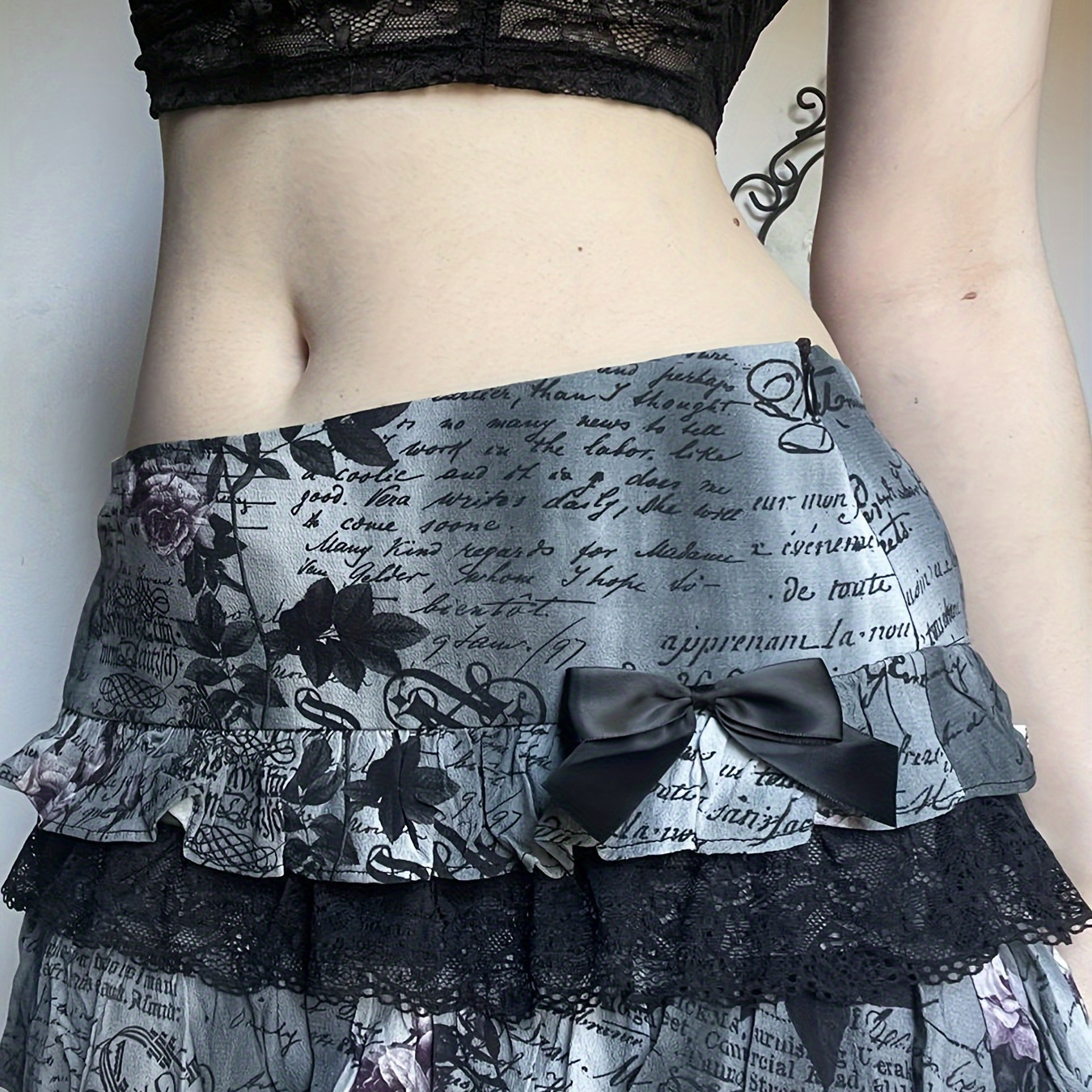 

Y2k-inspired Halloween Mini Skirt With Bow Detail - Gothic Print, Lace Panel, Tiered Cake Design, Low Waist, Polyester - Machine Washable