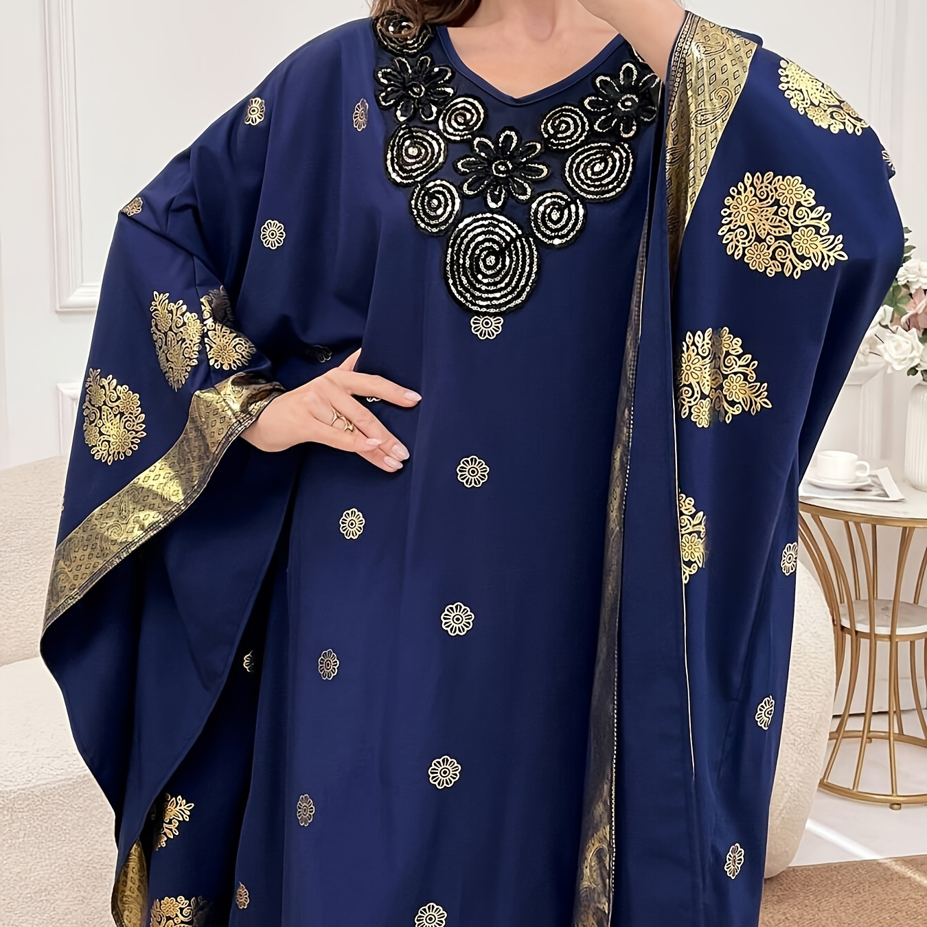 

A Loose-fitting Dress With Blue And Golden Batwing Sleeves, For Middle Eastern .