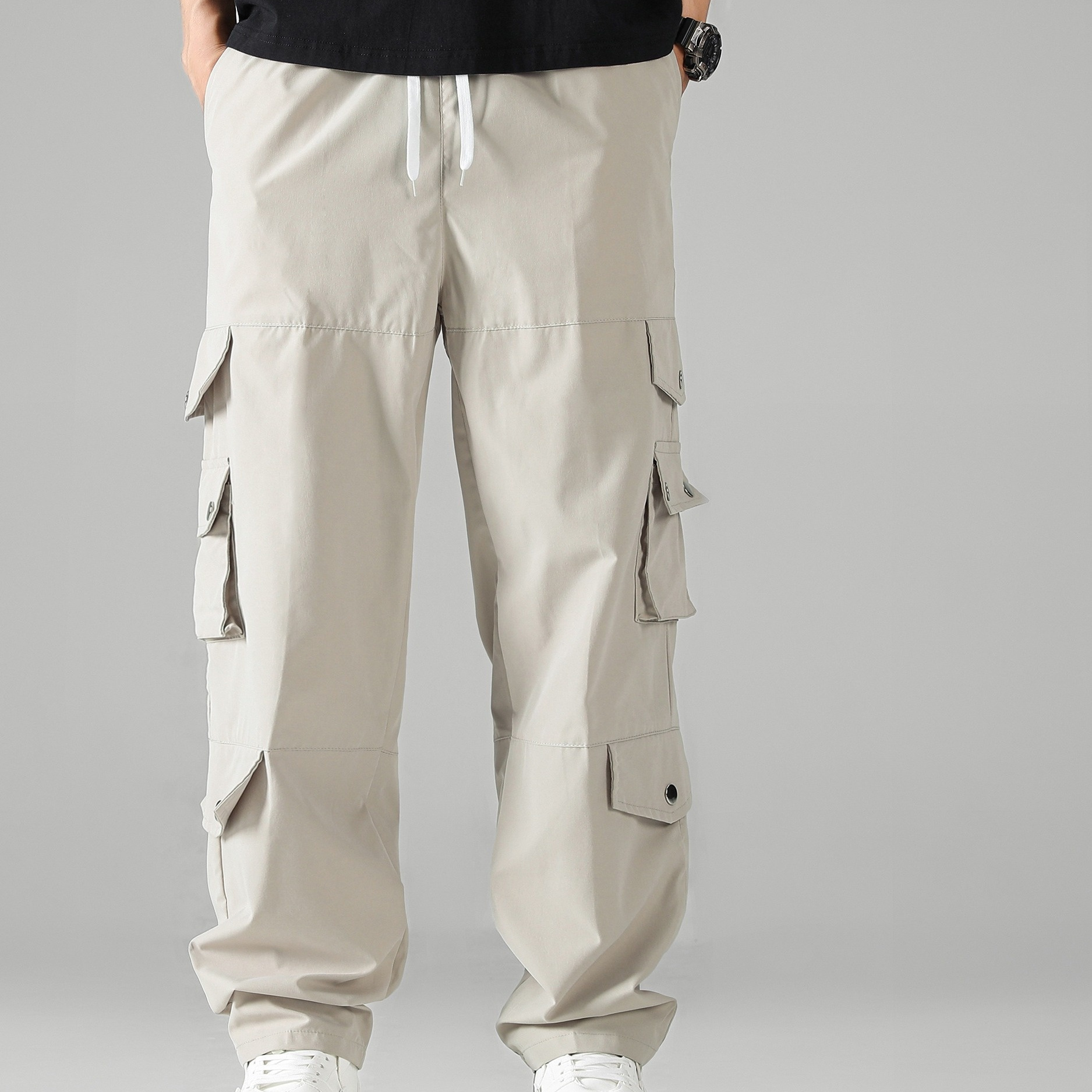 

Pantalon cargo décontracté de couleur unie pour homme avec cordon de serrage et plusieurs poches pour les loisirs de plein air et le travail.