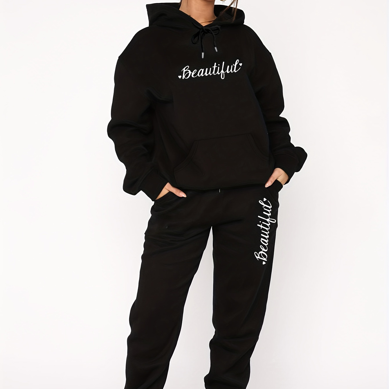

A Women's Hoodie And Pants Set With Letter And Heart Prints On A Fleece Base.