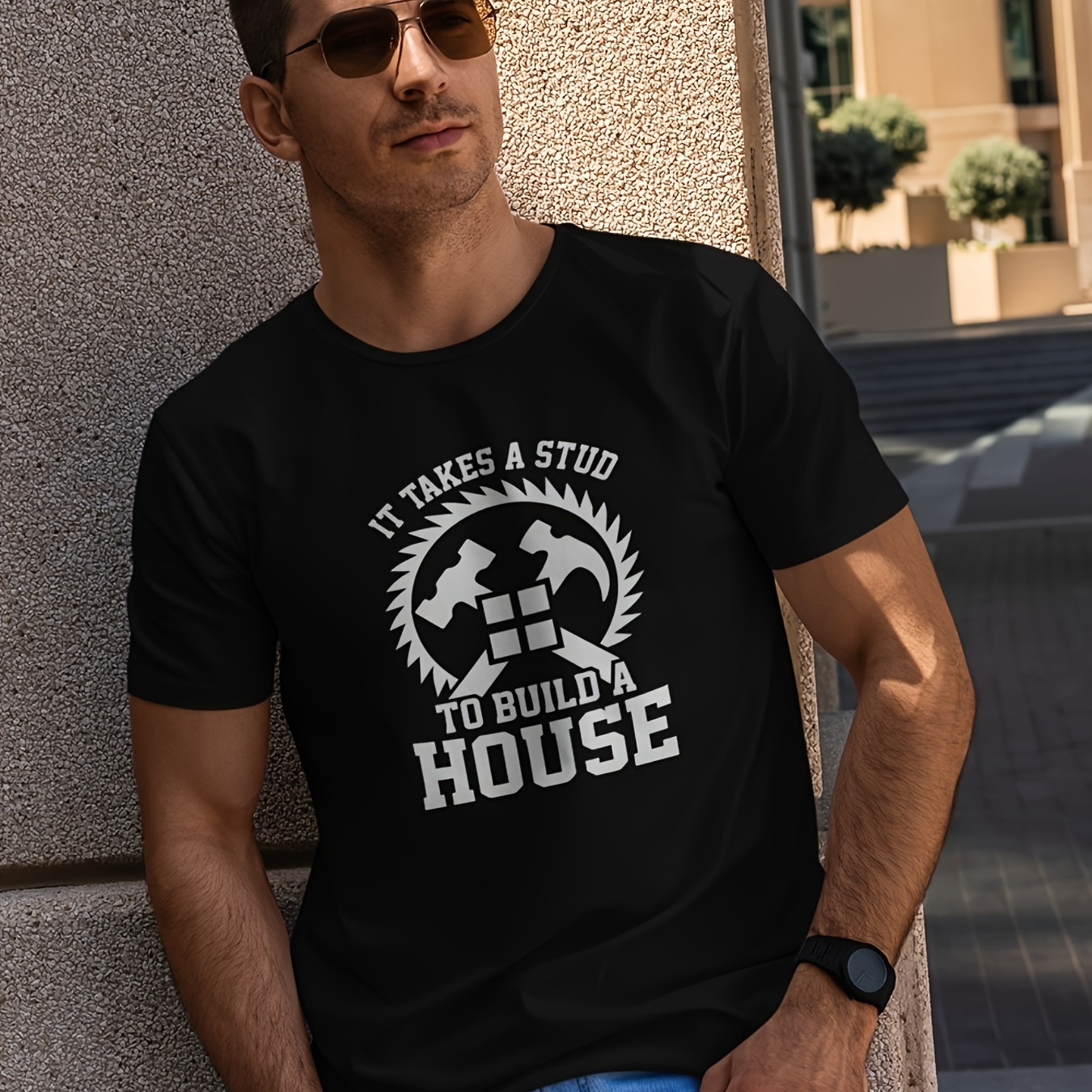 

Men's Black Cotton T-shirt With Unique Construction-themed Print - 'it Takes A Stud To Build A House' Slogan - Circular Saw And Hammer