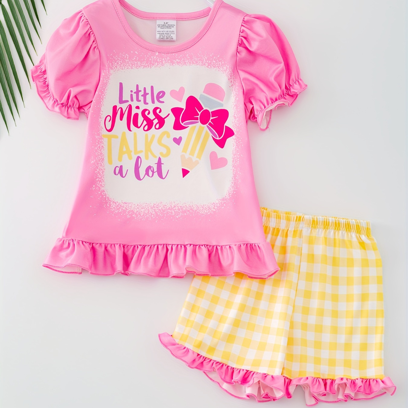 

2pcs Girl's Bow & Pencil Print Outfit Puff Short Sleeve Top + Plaid Shorts Holiday Casual Set Summer Clothes