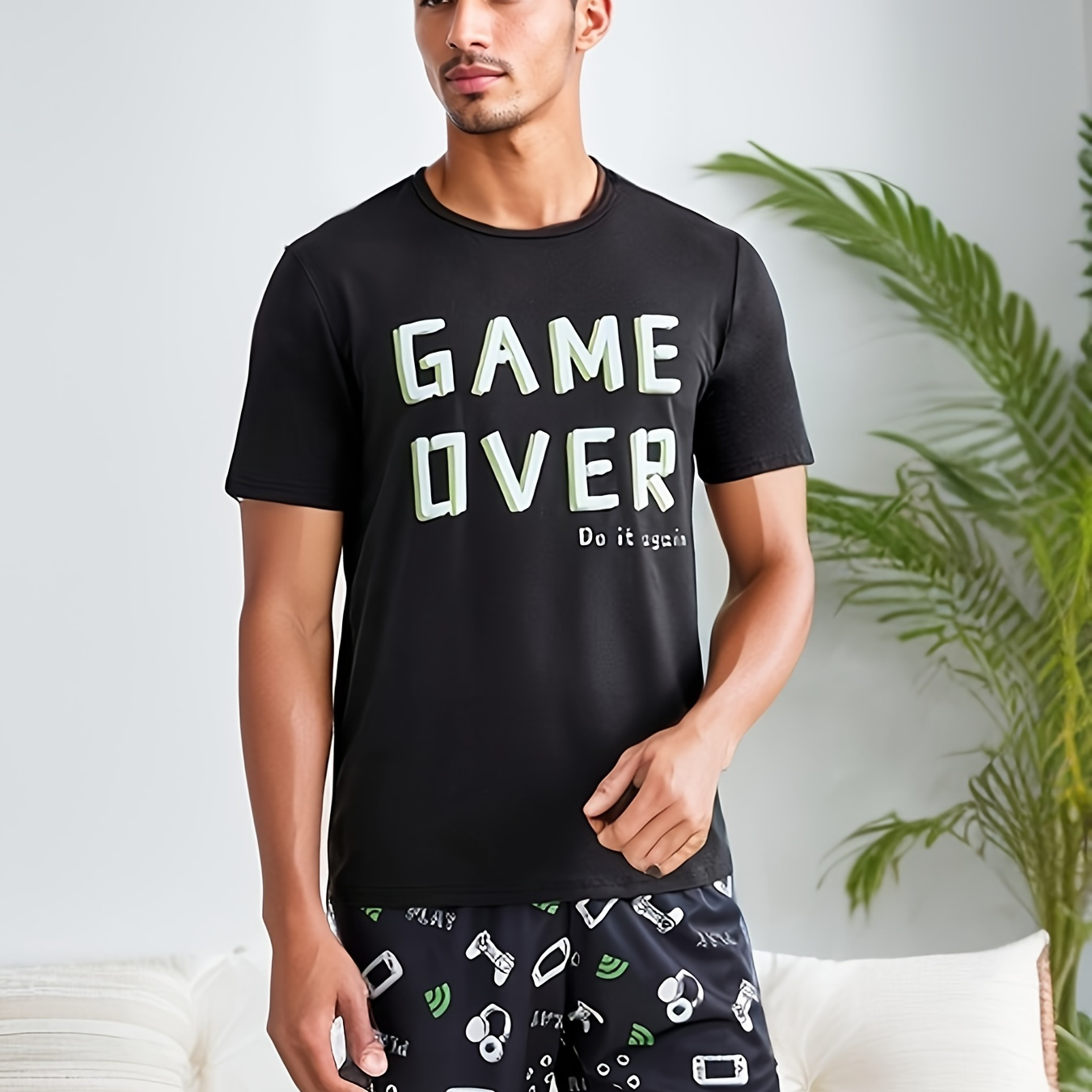 

2 pièces de pyjama pour homme avec imprimé de manette de jeu, col rond, manches courtes et short, style confortable et doux pour la peau, vêtements de détente confortables pour homme.