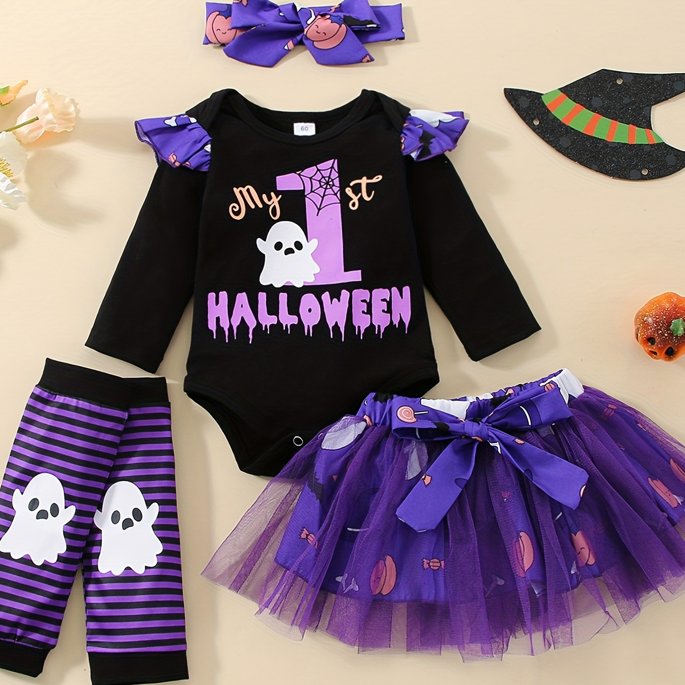 

Ensemble de vêtements d'Halloween pour bébés filles comprenant une jupe tutu, une barboteuse imprimée de fantômes, un bandeau et des jambières pour les enfants de 0 à 18 mois.