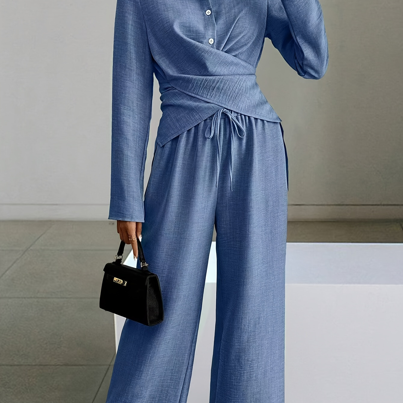 

A Two-piece Set For Women Consisting Of A Solid Color Long-sleeve Shirt And Pants.