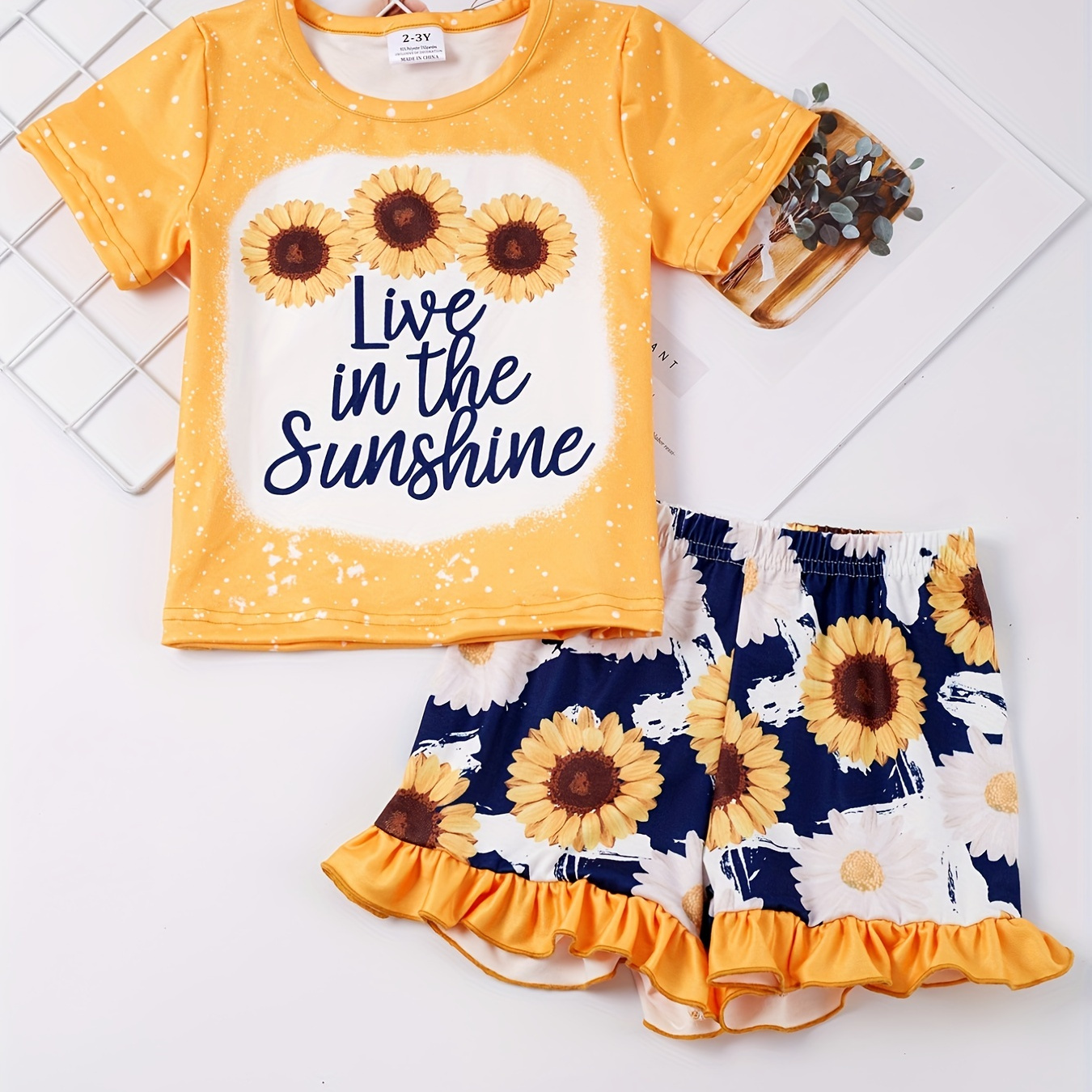 

2pcs Toddler Girls Letter Graphic T-shirt Casual Round Neck Tees Top & Ruffled Hem Sunflower Graphic Elastic Waist Shorts Set Kids Summer Clothes