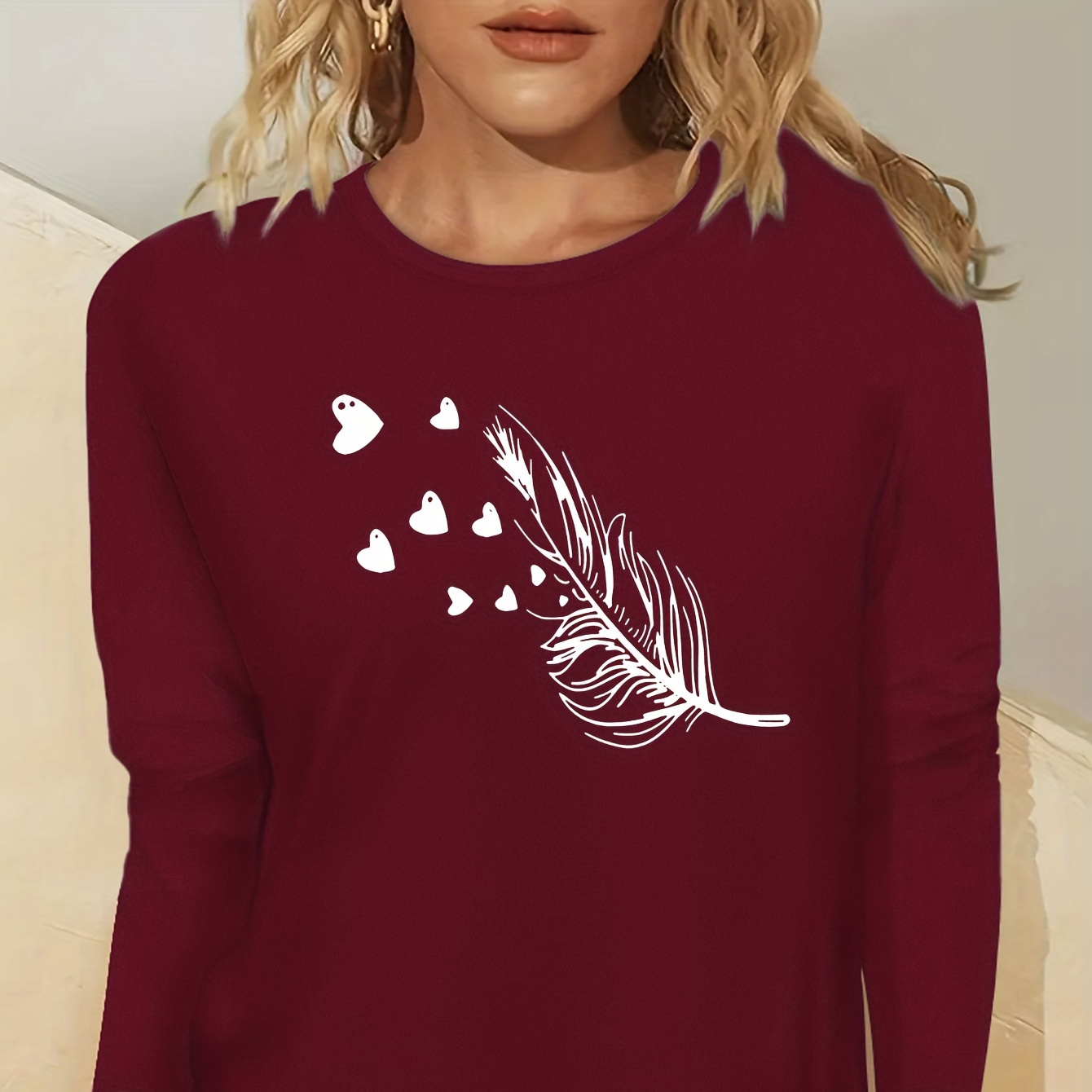 

Women's Casual Crew Neck Long Sleeve T-shirt With Feather And Heart Applique, 100% Polyester Knit Fabric, Slight Stretch, Regular Fit Pullover Top For All Seasons