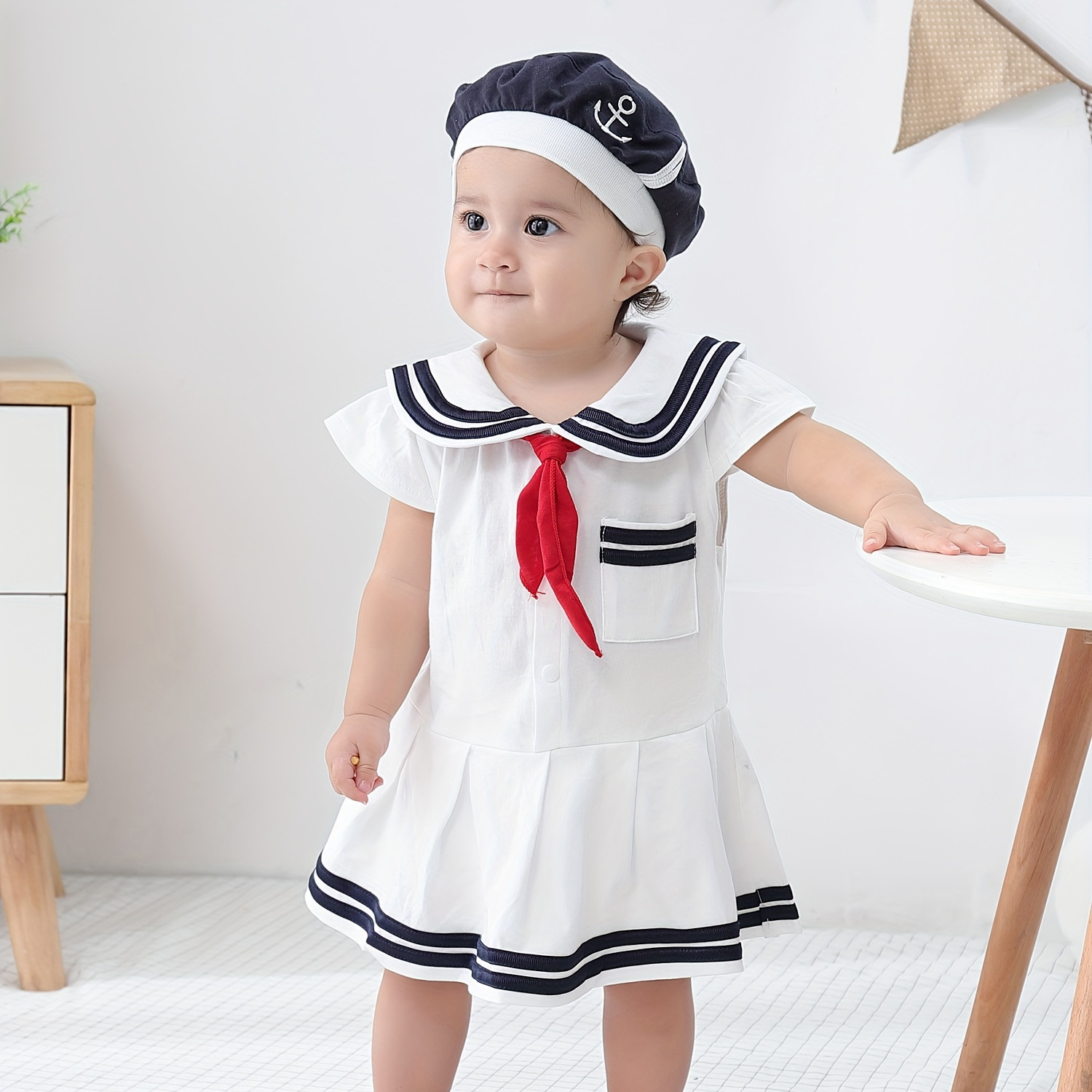 

Summer Girl Navy Triangle Jumpsuit Short Sleeved Baby Jumpsuit With Hat