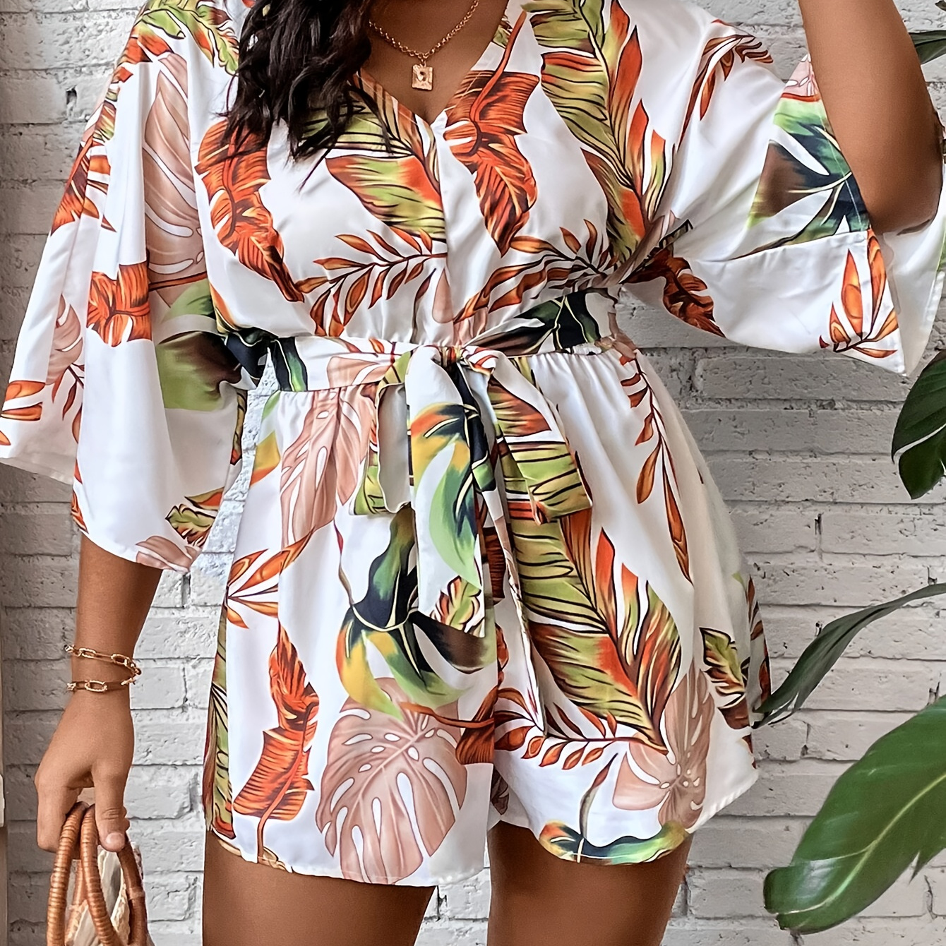 

Plus Size Leaves Print Belted Romper, Casual Short Sleeve V Neck Romper, Women's Plus Size clothing
