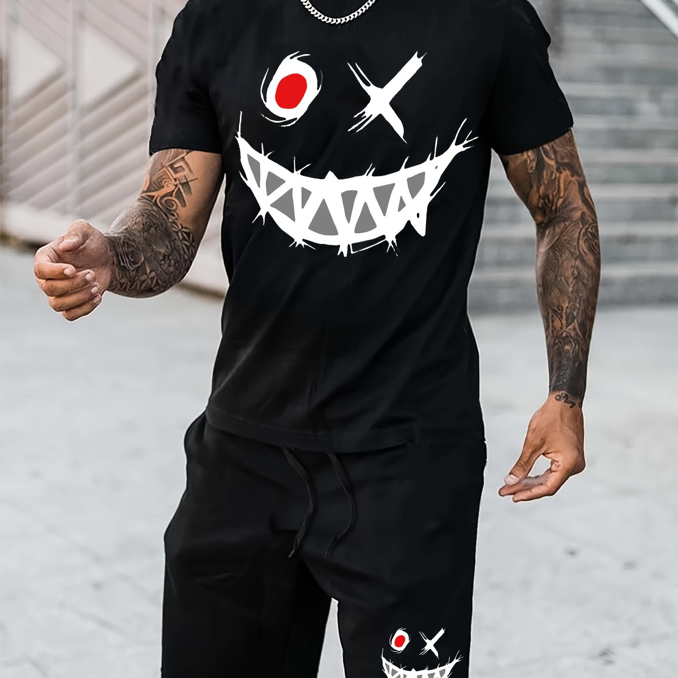 

2-piece Men's Creative Evil Face Graphic Print Summer Outfit Set, Short Sleeve Crew Neck T-shirt & Elastic Waist Shorts With Pockets