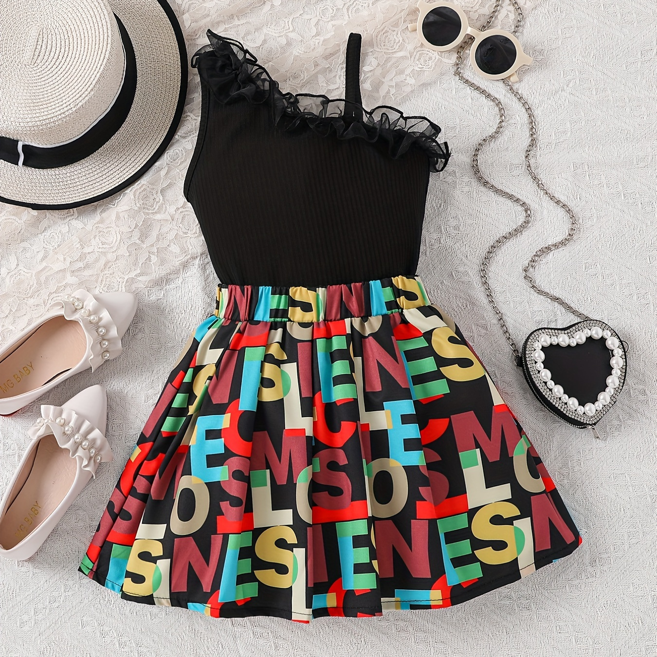 

2pcs Toddler Girls Asymmetrical Neck Ruffle Trim Ribbed Knit Top & Letter Graphic Skirt Set Kids Summer Clothes