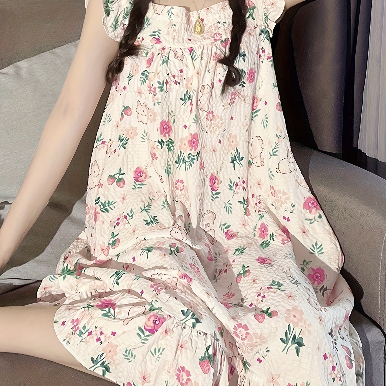 

Adorable nightdress with rabbit and floral print, featuring charming ruffle sleeves, a square neckline, and a frilly hem. Perfect for women's sleepwear.