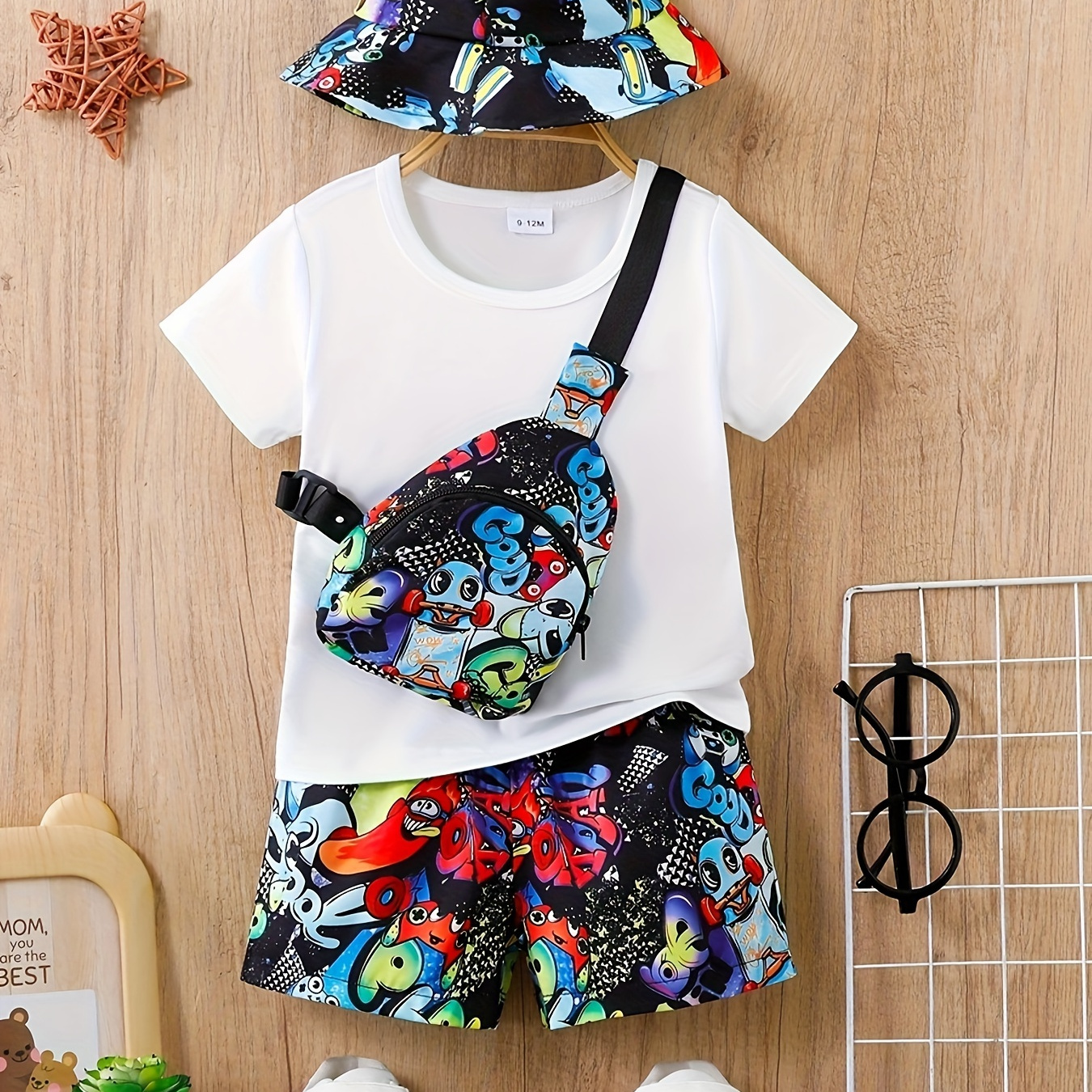 

4-piece Baby Boy's Trendy Outfit Set, Short Sleeve White T-shirt, Monster Cartoon Print Shorts, Coordinating Hat & Crossbody Bag