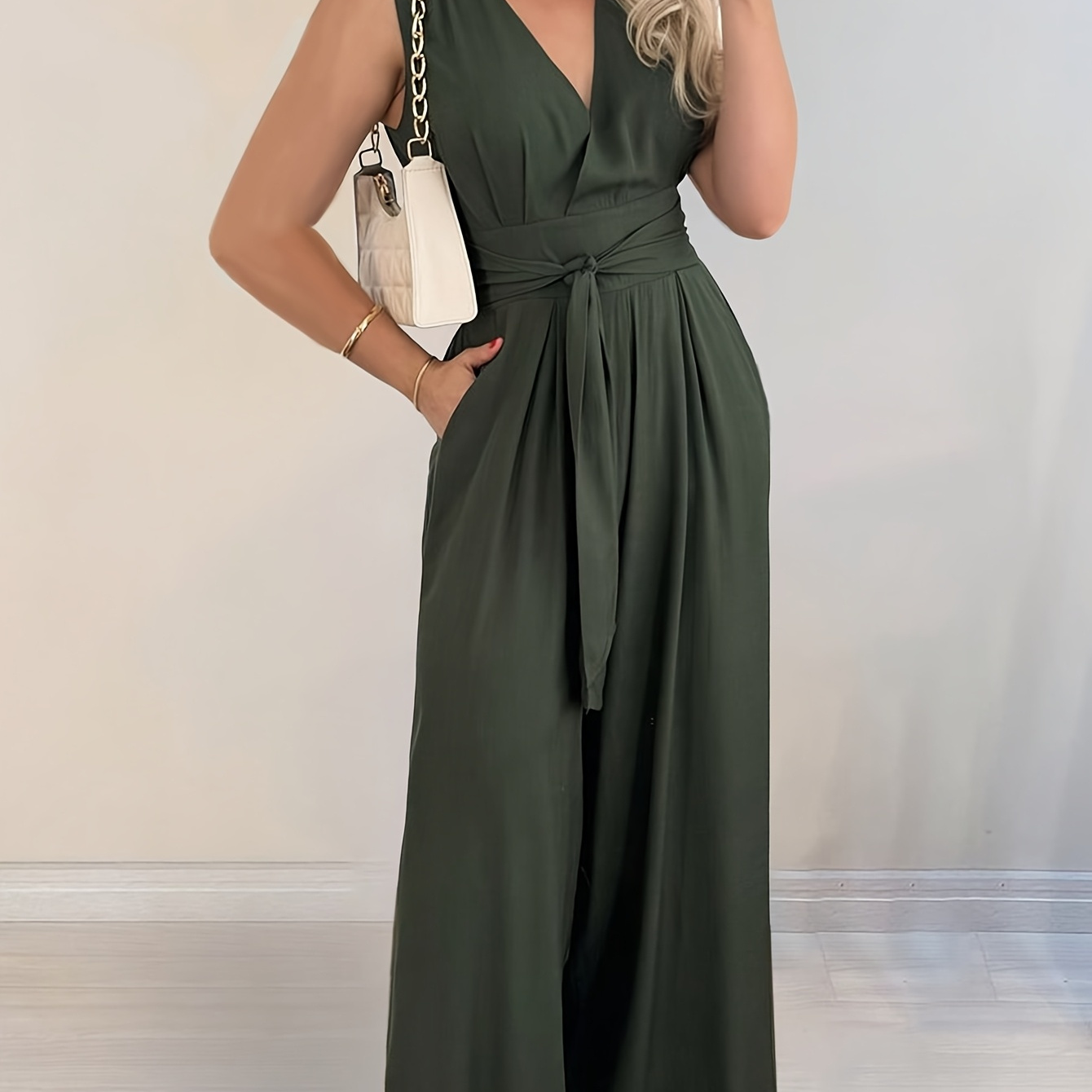 

Has An Elegant Jumpsuit With A Belt.