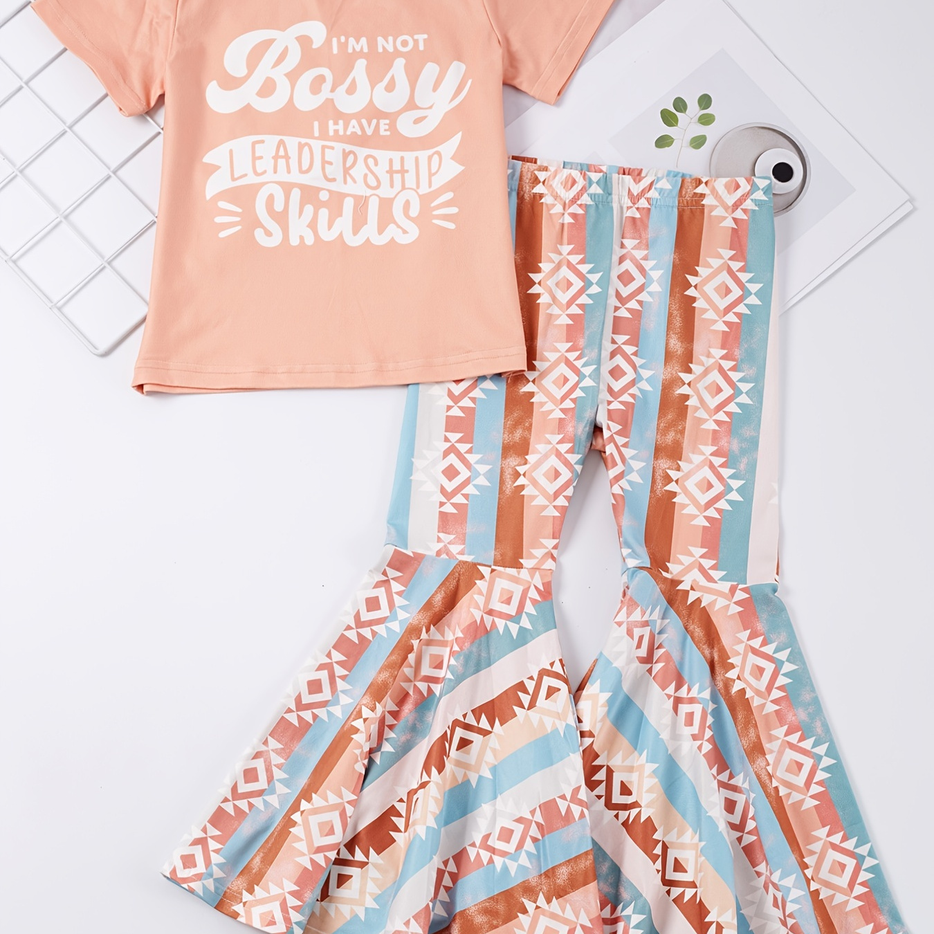 

2pcs Girls Letter Graphic T-shirt Round Neck Short Sleeve Tee Tops & Elastic Waist Striped Abstract Graphic Flare Leg Pants Set Kids Spring Summer Clothes