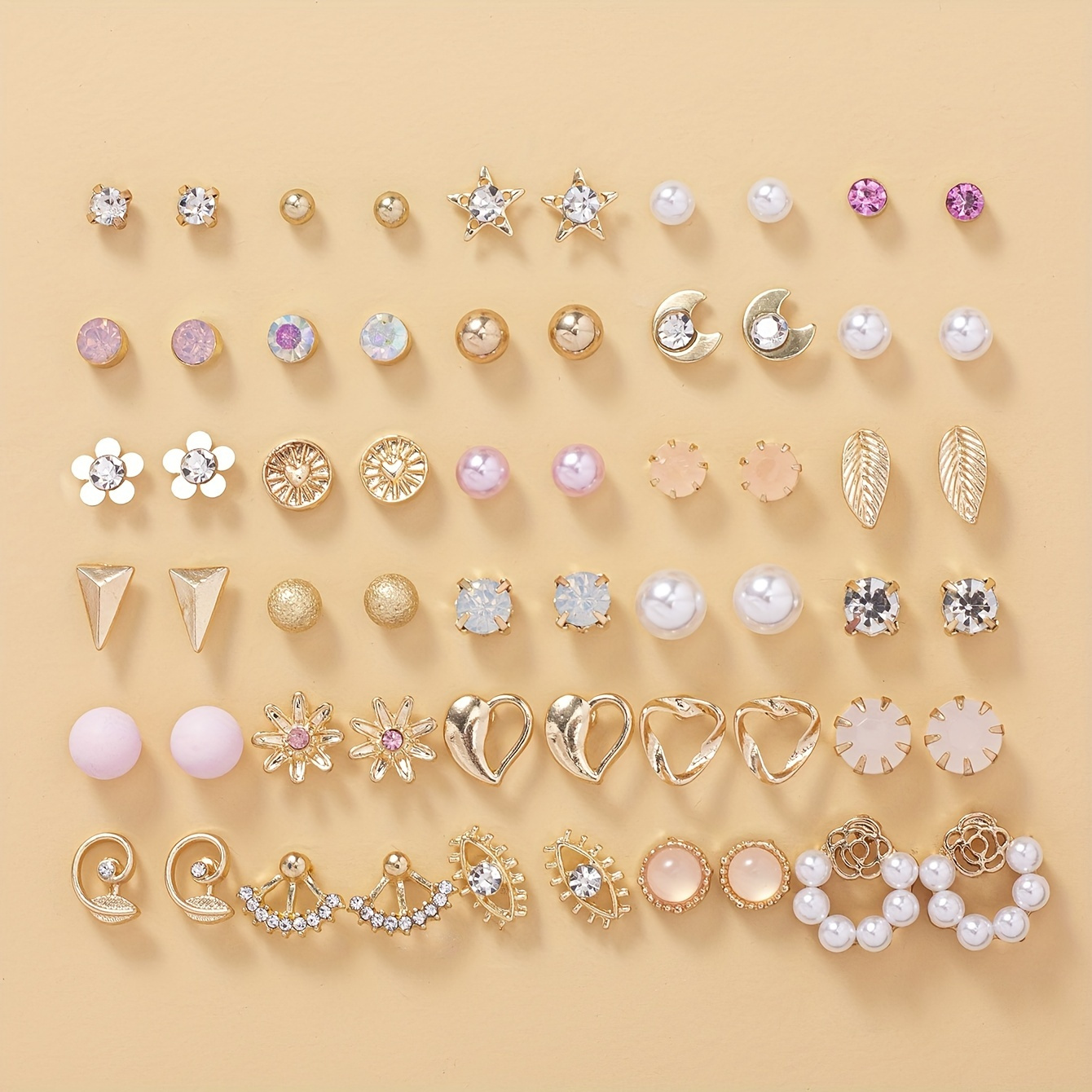 

Ensemble de boucles d'oreilles avec 30 paires de fausses perles simples, ornées de motifs de feuilles, d'amour et de lune, incrustées de zircons, pour les accessoires quotidiens des femmes.