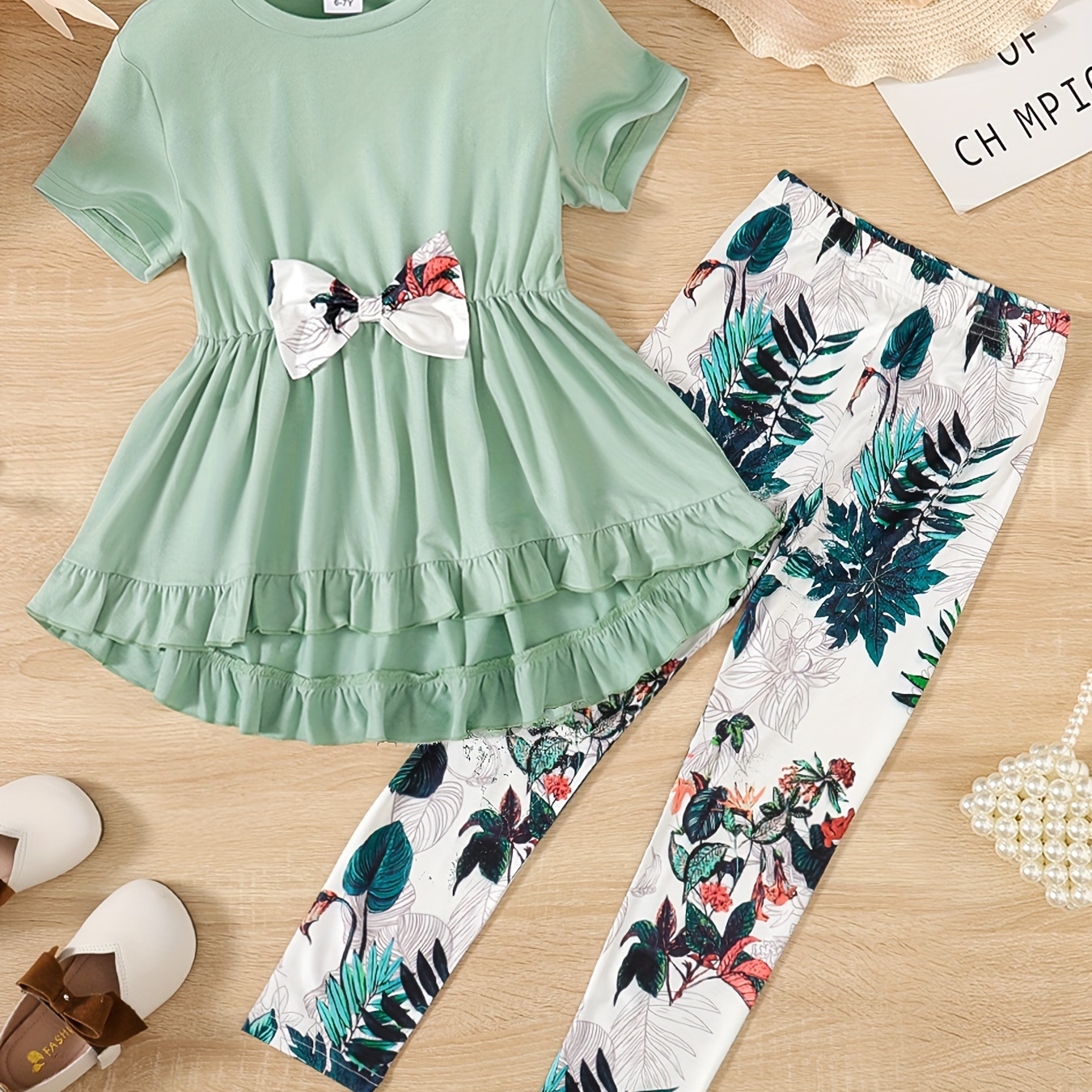 

2pcs Kid Girl Fancy Bow Front Round Neck Ruffle Hem Short-sleeve Peplum Top And Floral Print Leggings Pants Set For Spring & Autumn/fall