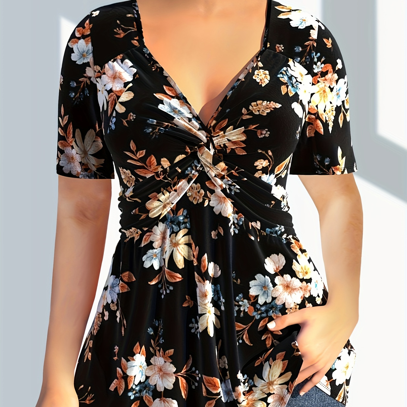 

T-shirt à imprimé floral grande taille avec devant torsadé, élégant haut à col en V à manches courtes pour le printemps et l'été, vêtements grande taille pour femmes