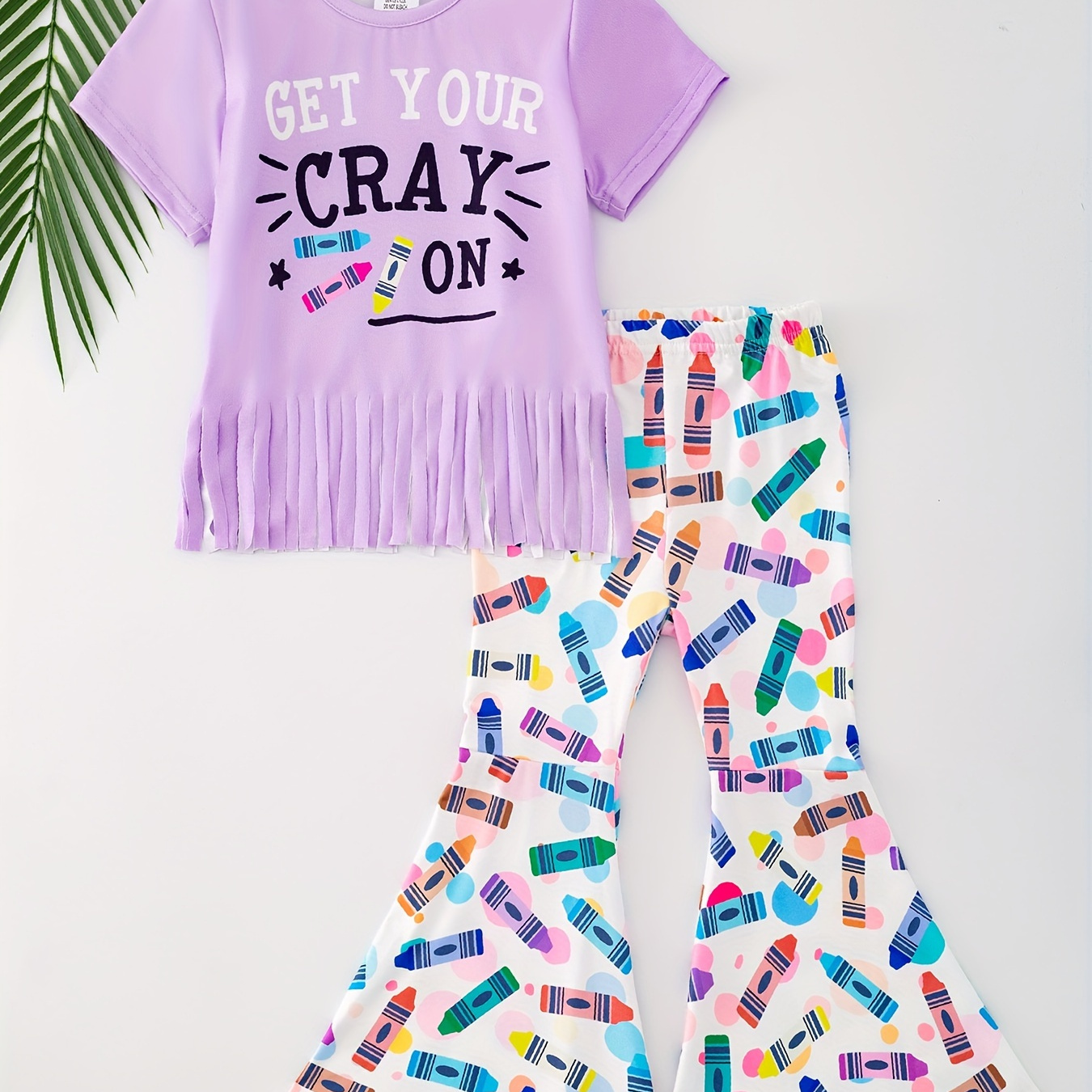 

2pcs, Letters Print Tassel Hem Short Sleeve Crew Neck T-shirt + Crayon Pattern Flare Pants Set For Girls, Versatile Set Homecoming Day Summer Gift