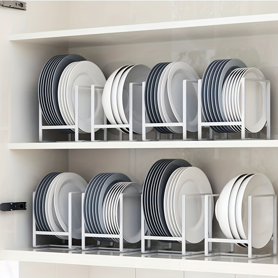Dish drying metal rack with big nice white clean kitchenware. Traditional  wall cabinet kitchen Stock Photo by Vladdeep