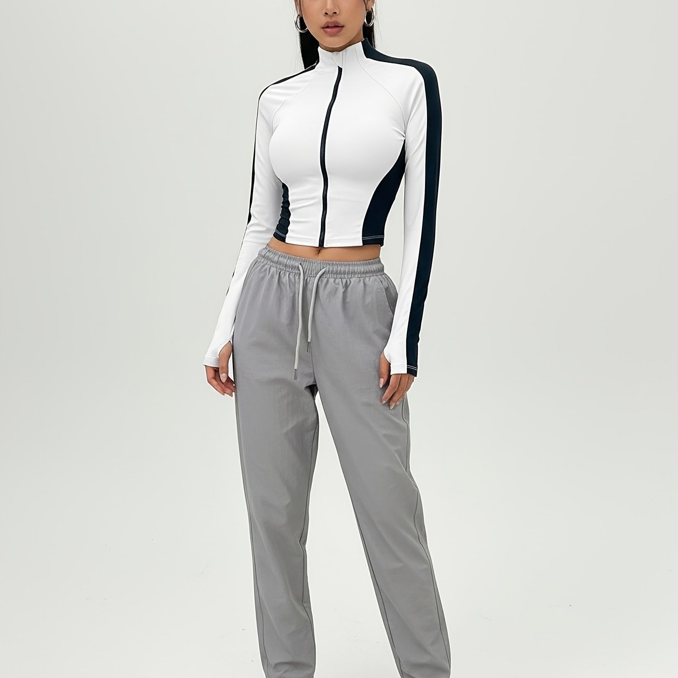 Image of Women's Black And -block Zip-up Sports Jacket, Long-sleeve Cropped Yoga Top With Thumb Holes, Skin-friendly Breathable Outdoor Sports Jacket
