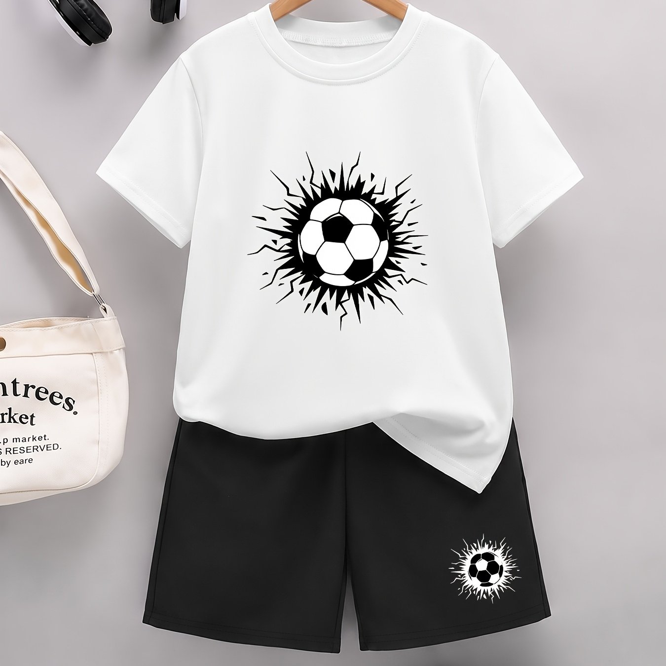 Image of Boys' Short-sleeve T-shirt And Shorts Set, Black And White Minimalist Cracked Football Pattern, Stylish And Comfortable For Spring And Summer, For Outdoor