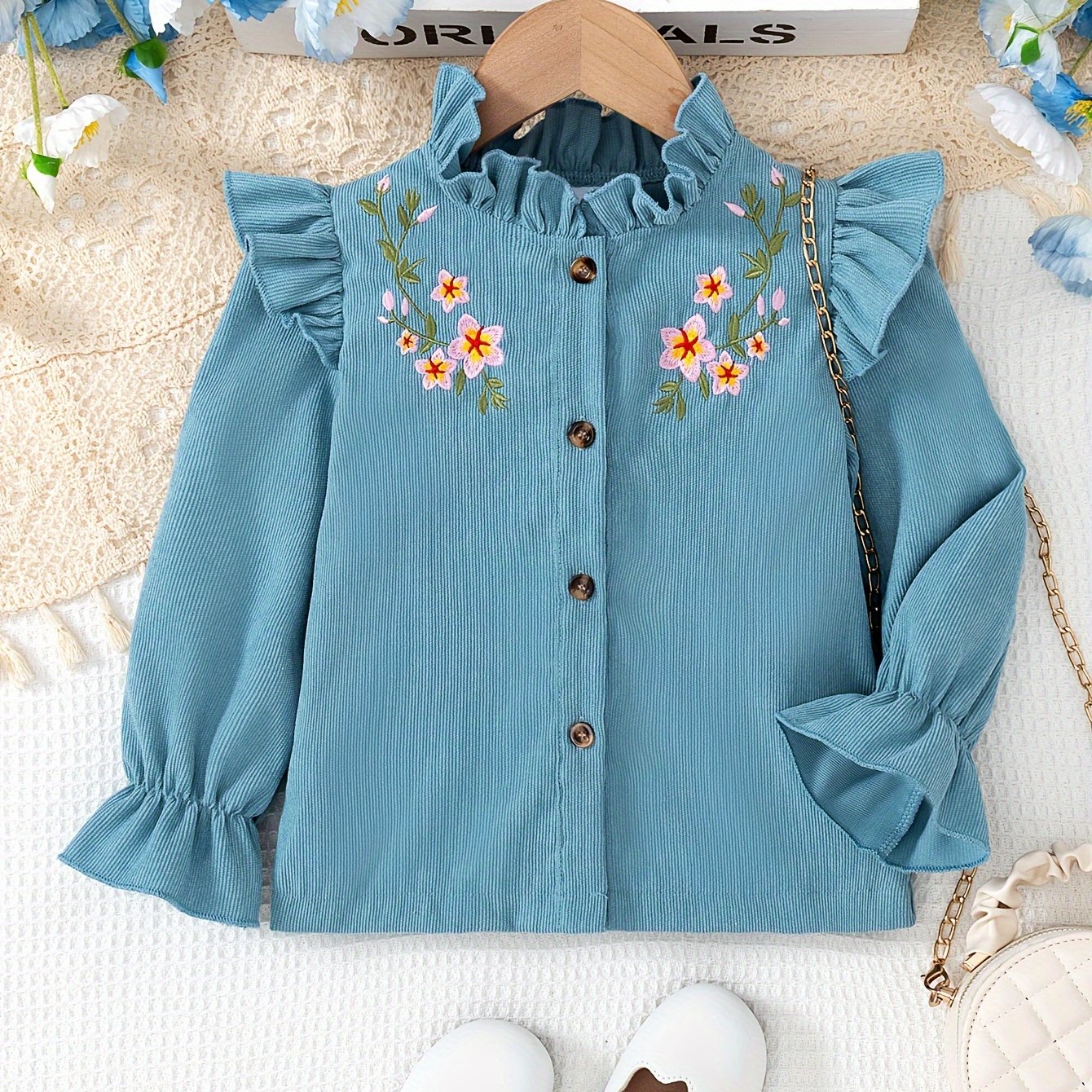 Image of A Stylish And Casual Long-sleeve Top For Girls, Featuring A Solid Color With Floral Embroidery, Button Details, And A Lace Collar, Perfect For Spring