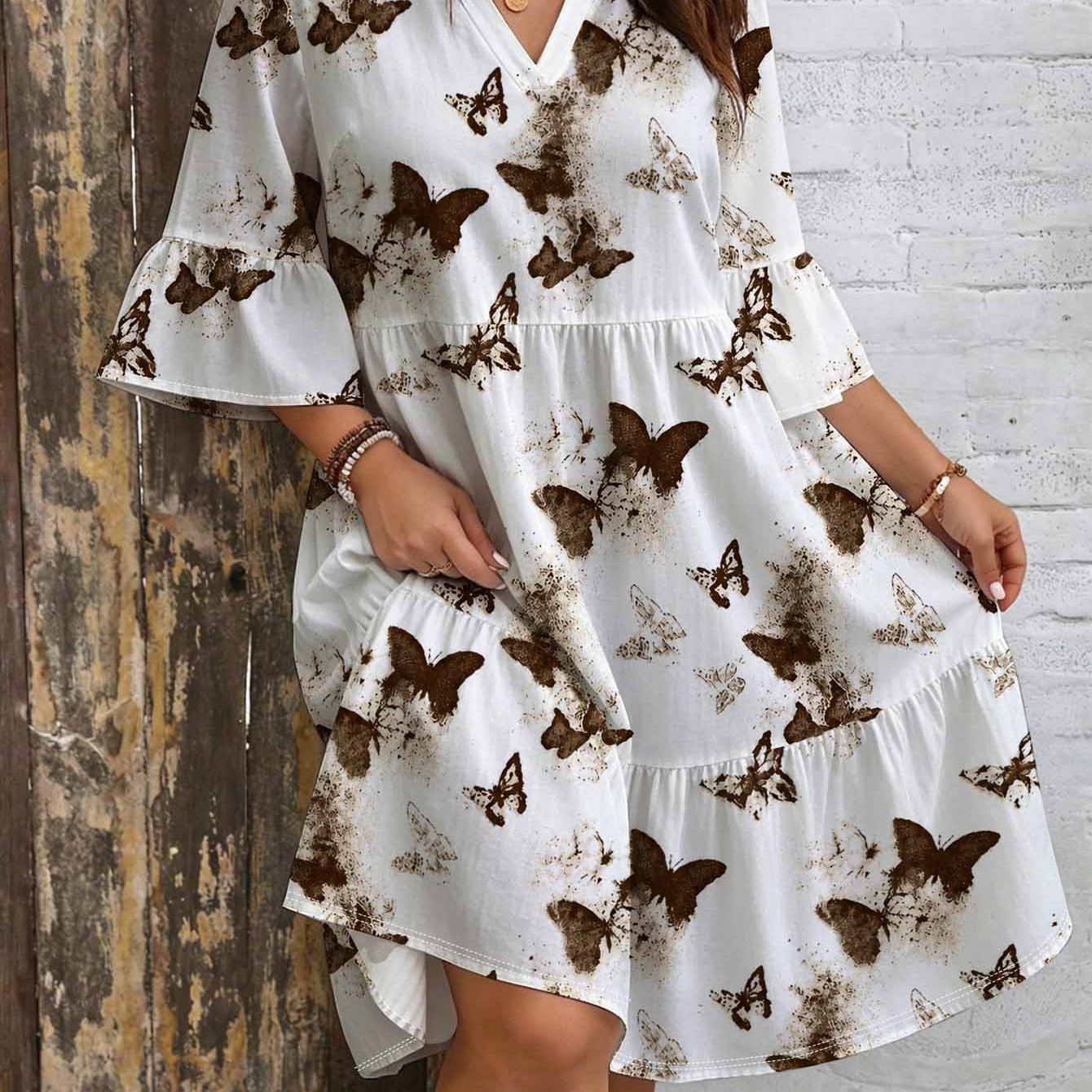 Image of Plus Size Print Dress. V-neck. Bell Sleeves. Layered Skirt. Loose Fit. Brown And White Elegant Vintage Bohemian Style Dress. Perfect For Casual Beach Party Wear