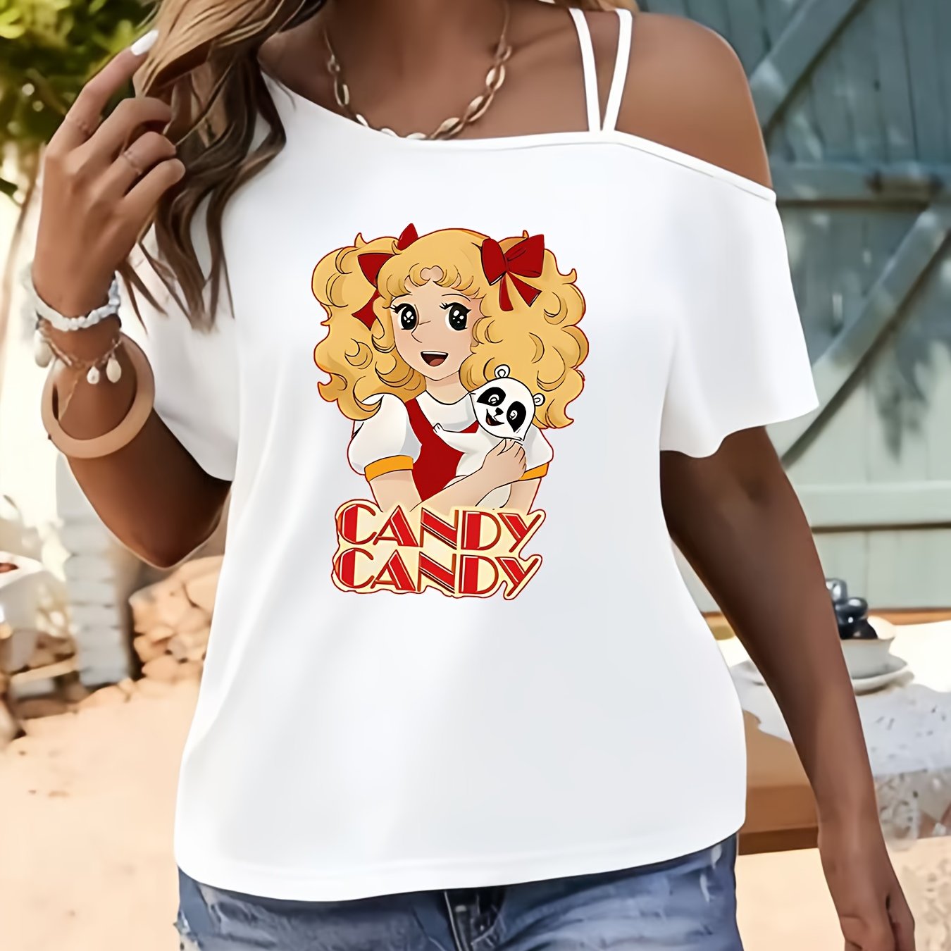 TEMU T-shirt à bretelles pour femme, manches courtes et épaules dénudées, avec une blonde aux queues de cheval et une poupée, du thème 'CANDY'. Ce