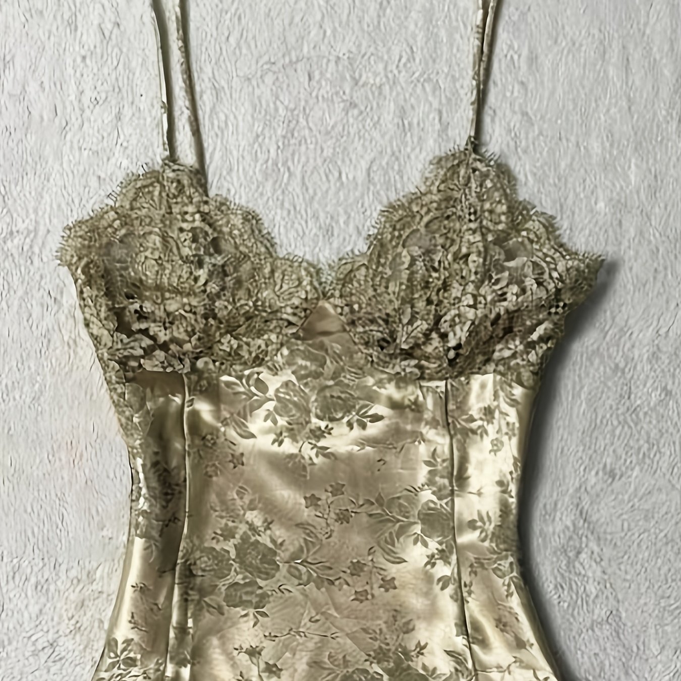 Image of A Pure And Sensual Lace-up Camisole For Women. The Lace V-neck Adds A Soft Texture, While The Thin Shoulder Straps Line, Making It A Versatile Piece For Vacation-style Or Date-ready Outfits