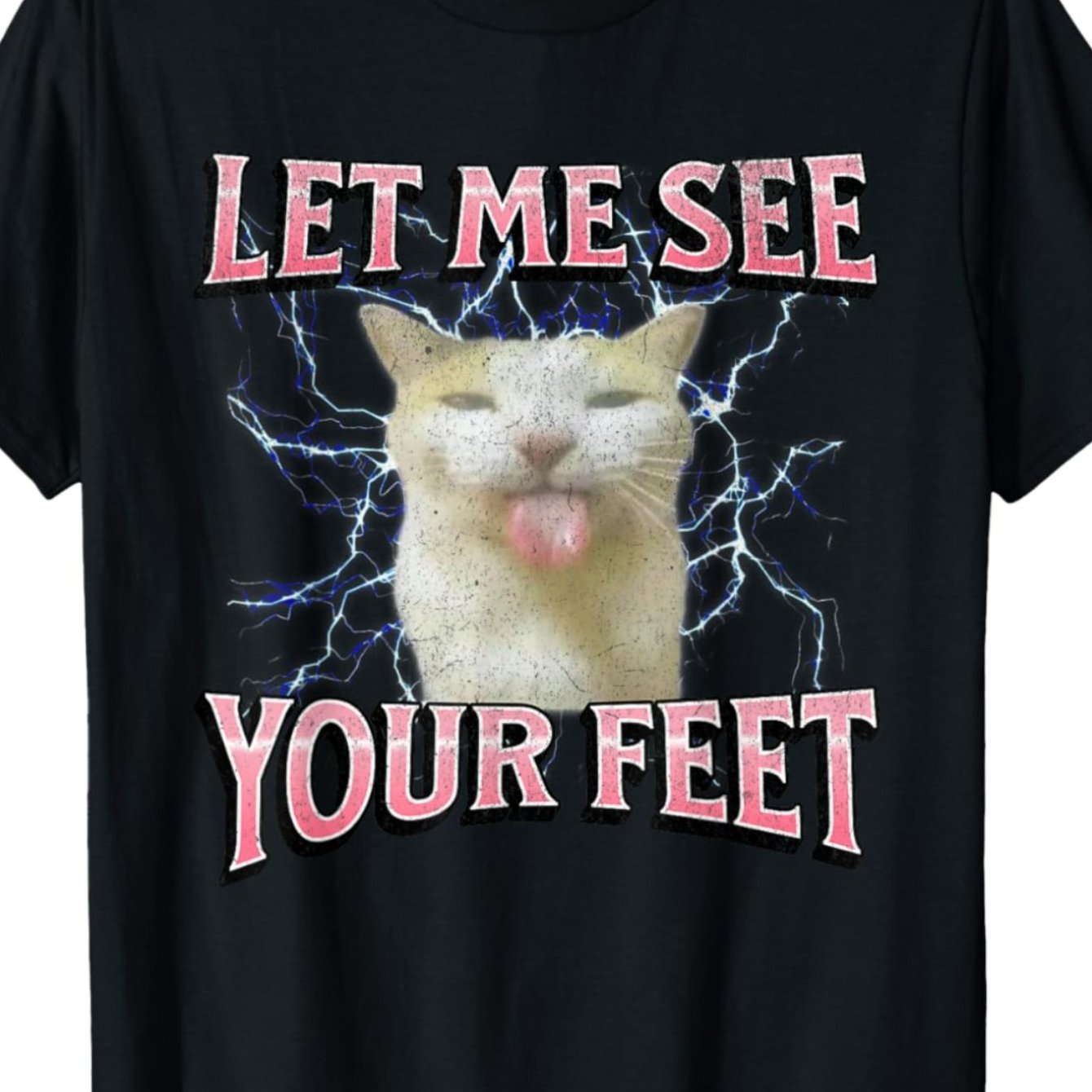 Image of Men's Humorous Graphic Tee Featuring A Cat Meme With ' See Your Feet' In Pink Text. This Black, Regular Fit, Short Sleeve Shirt Has A Lightning Design, Is Machine Washable, And A