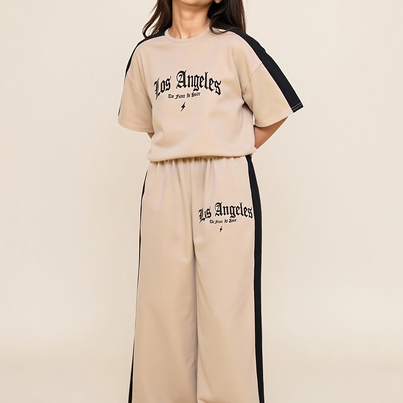 Image of A Two-piece Set For Featuring A Loose-fitting, Versatile Top And Relaxed, Stylish Wide-leg Pants, Perfect For Summer, For Outdoor