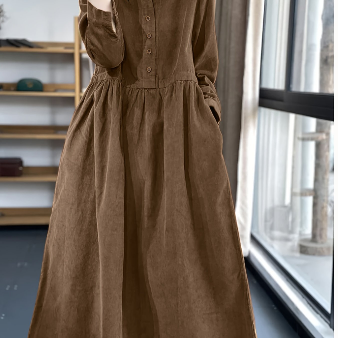 Model wearing a stunning retro Chinese style maxi dress in soft polyester featuring a stand collar button detailing and long sleeves Perfect for autumnwinter