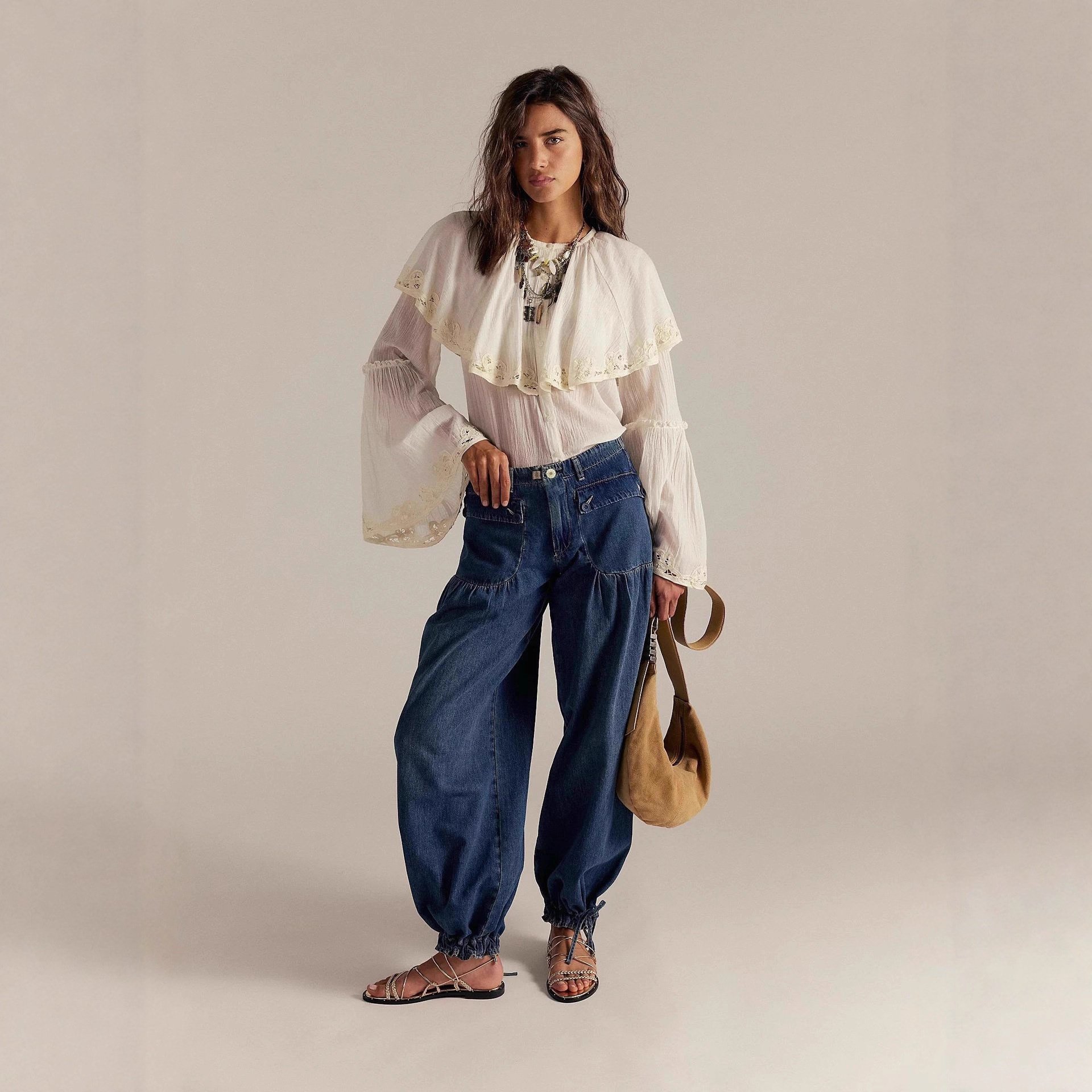 Image of Loose-fitting Denim Pants For Women Featuring High Waist And Balloon Style, Complete With Drawstring Ankles, Street Style