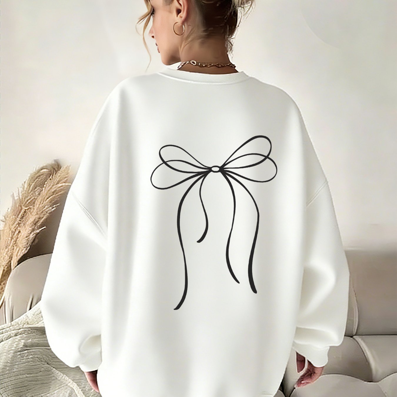 Image of Y2k Women's Crew Neck Pullover Sweatshirt - White With Black Bow Print, Loose Fit, Minimalist Casual Top, Machine Washable, Local Warehouse