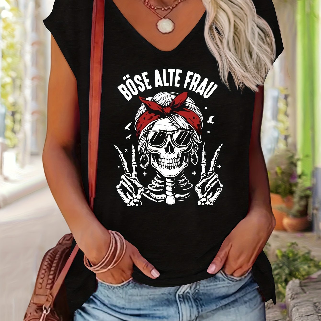Image of A Casual And Comfortable Short-sleeve V-neck T-shirt For Women Featuring A Skull Print With A Bow, Designed In A Easy European And