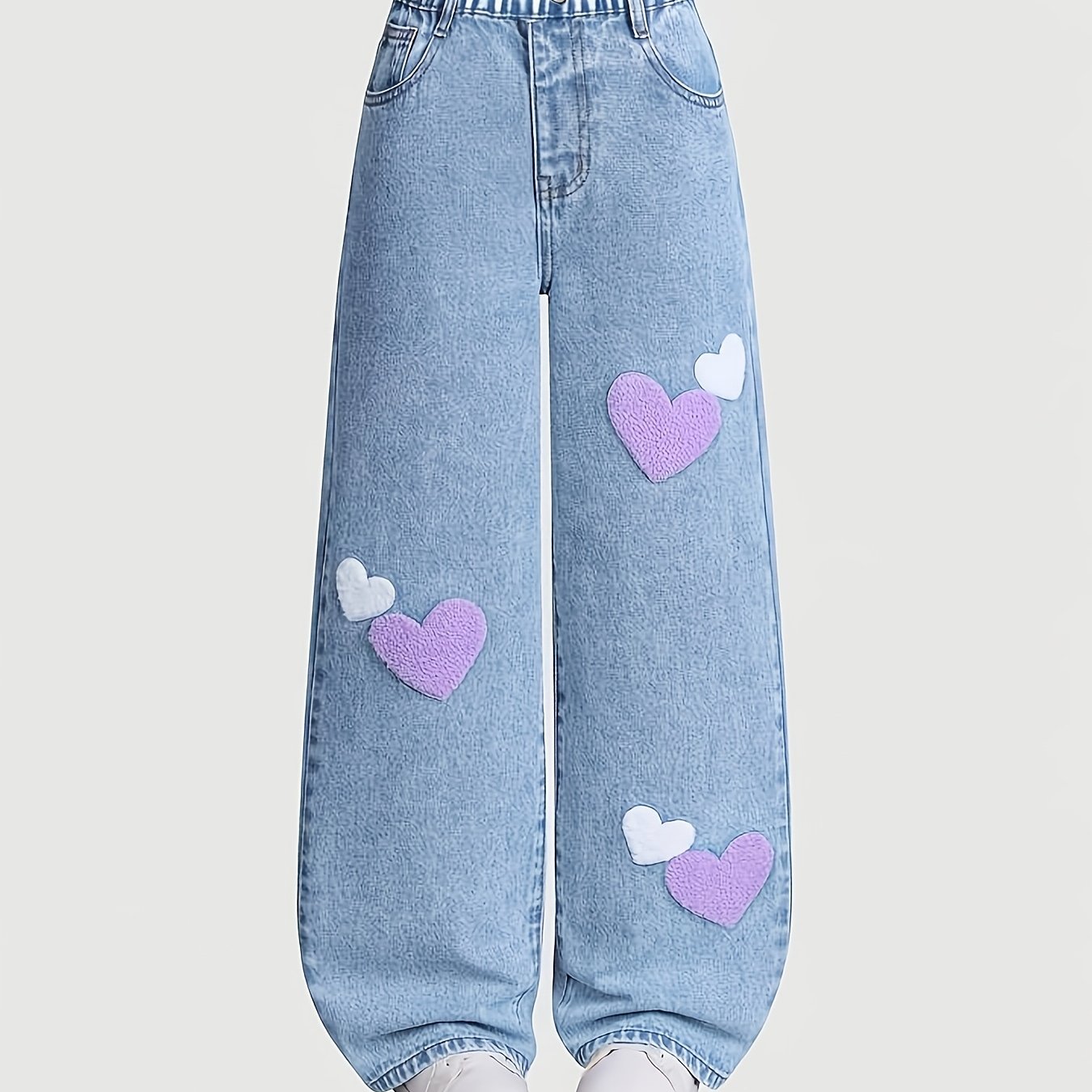 Image of Light Blue Washed High-waist Jeans, With Towel Embroidery On Legs, Predominantly Light Purple And White, Scattered On Sides Of The Trousers, Soft Texture With Romantic Colors